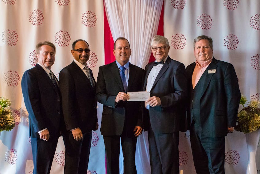 John Griffin, center, president of WP Griffin Inc., presents board members of the Grocery Foundation of Atlantic Canada, from left, Jim Cooke Perry Chippin, Kevin Connors and Tom Margeson with the results of his company’s Dig In Do Good promotion. The promotion raised $32,732 which the Grocery Foundation will distribute to the region’s three children’s hospitals