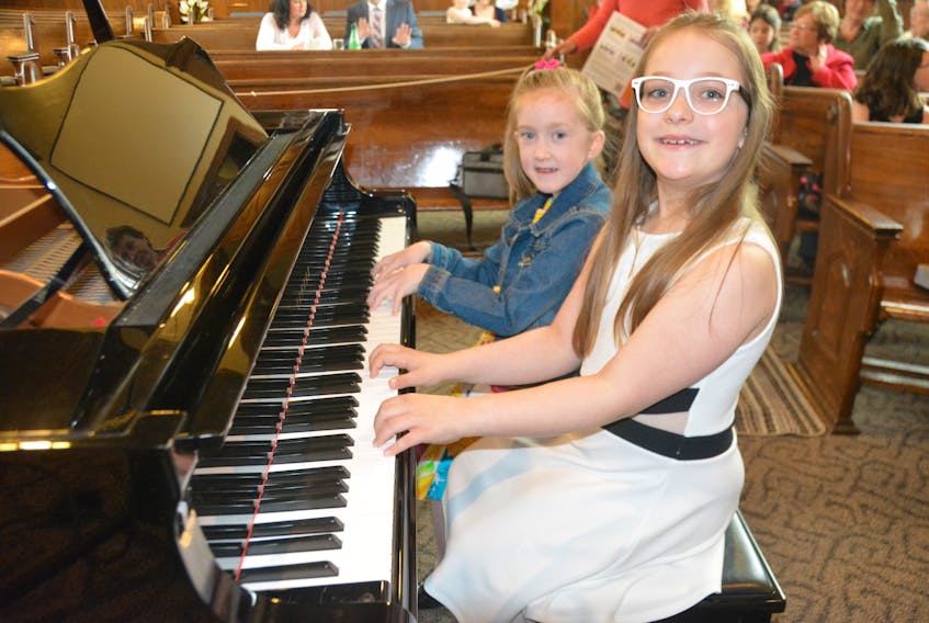 Annissa Coles, 6, left, and Clarity Smith, 8, are two of many participants in this year’s East Prince Music Festival.