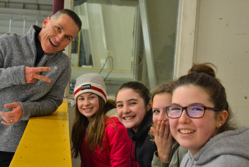 Elvis Stojko interacts with figure skating fans, from left Amiyah Getson, Kari-lee MacWilliams, Faith Sheehan and Kalyn MacWilliams during his practice skate at O’Leary Community Sports Centre on Friday. Stojko, a three-time world singles champion and two-time Olympic silver medalist, will perform Sunday during the O’Leary Figure Skating Club’s annual ice show, Toys on Ice. The show is set for 2 p.m. and tickets are being sold in advance at O’Leary Guardian Drug only.