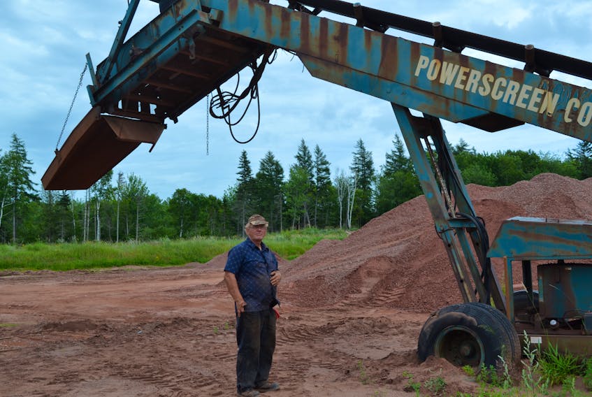 Stewart Enterprises employee, Elmer Dumville shows where someone drove a loader up the company’s gravel pile only to have it coast backwards and crash into a screener. Company owner Larry Stewart said damages to his equipment could be in the $15,000 range.