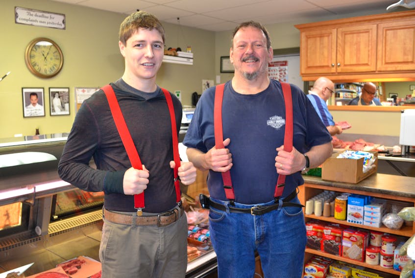 Eugene’s General Store manager-in-training, Carter Morrissey, left, is picking up where out-going owner, Tommy Perry leaves off.  Tommy and Joanne Perry’s last day as store owner is Feb. 1. Joey Morrissey takes over as owner on Feb. 2 and his son Carter takes over as manager, red suspenders and all.