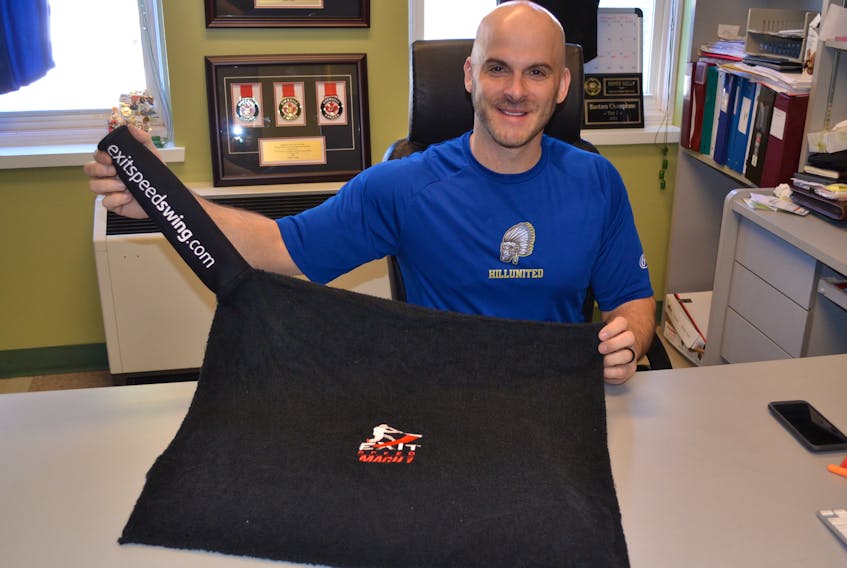 Jeff Ellsworth displays the Mach I version of the patented Exit Speed Swing training aid he and his business partner, Jeff Keough are marketing. They take their product to a Toronto audition of Dragons Den in May.