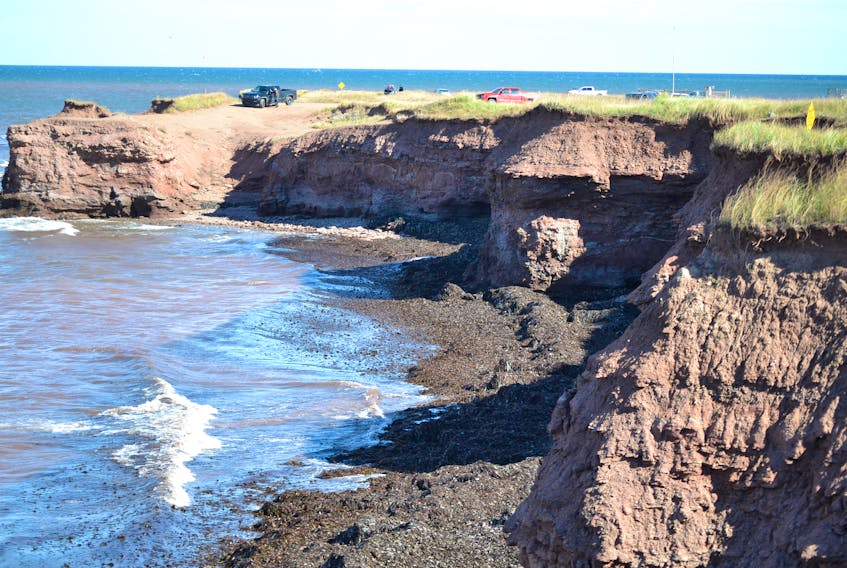 This section of North Cape beach, below the “dangerous cliffs” sign to the right of the image is the location where a searcher discovered a body just after daybreak Sunday.