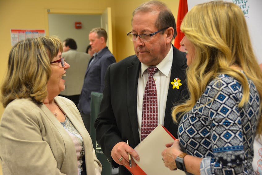 Barb Broome, left, Executive Director of the East Prince Youth Development Centre, chats with Sonny Gallant, Minister of Workforce and Advanced Learning and Tina Mundy, Minister of Family and Human Services, during a funding announcement in Summerside, Wednesday.