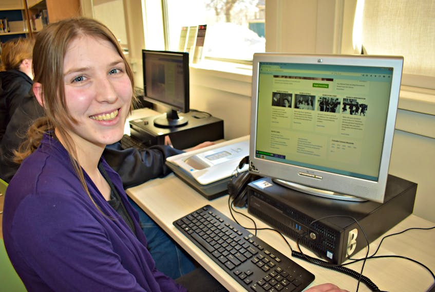 Caitlin Plomp researches her ancestry at the Summerside Rotary Library.