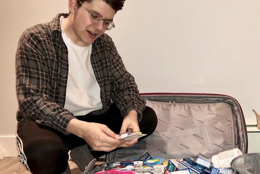 Jake Shea of Anglo P.E.I., sorts through a supply of medical, dental and hygiene products he and fellow members of the Dalhousie Chapter of Global Brigades will be distributing in Honduras this week. This is Shea’s second visit to the country with Global Brigades.