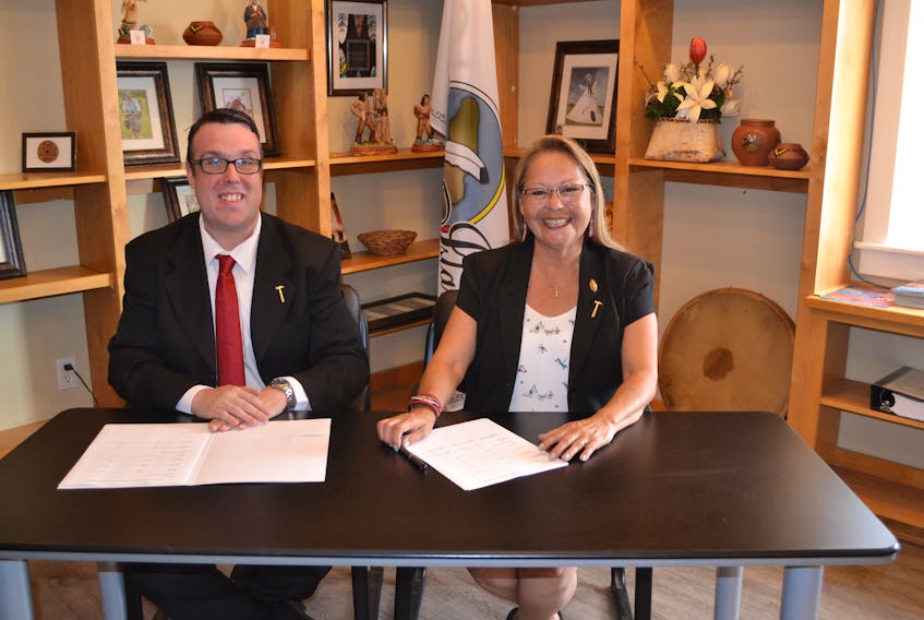 Aaron Brown, executive director for Habitat for Humanity Prince Edward Island and Chief Matilda Ramjattan, Lennox Island First Nation sign a memorandum of understanding which will see Habitat build at least five homes in the First Nation Community over the next three years.