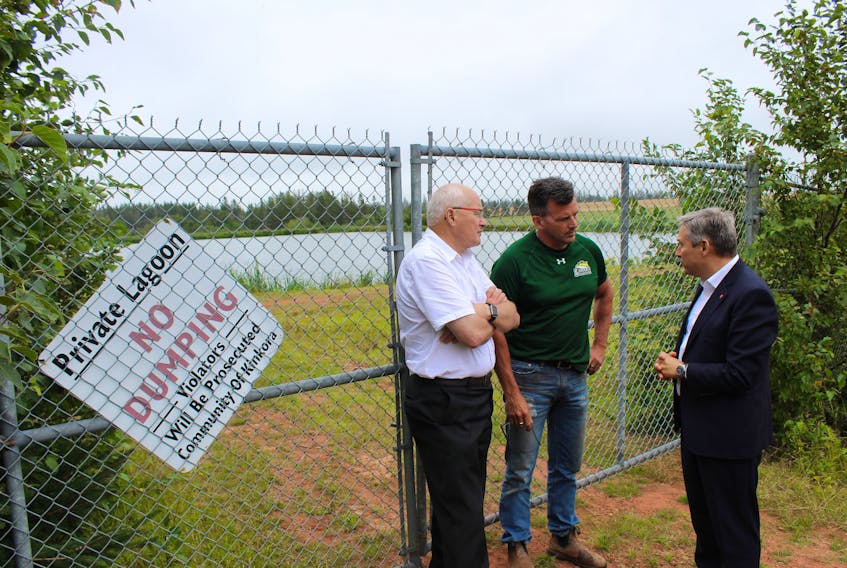 Malpeque MP Wayne Easter, left, speaks with Kinkora Coun. Robert Duffy, centre, and federal Infrastructure Minister François-Philippe Champagne, Thursday afternoon.