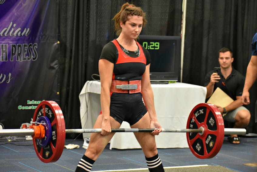 Leanne McLaughlin competes in the deadlift with a 297.6 pounds weighted bar.