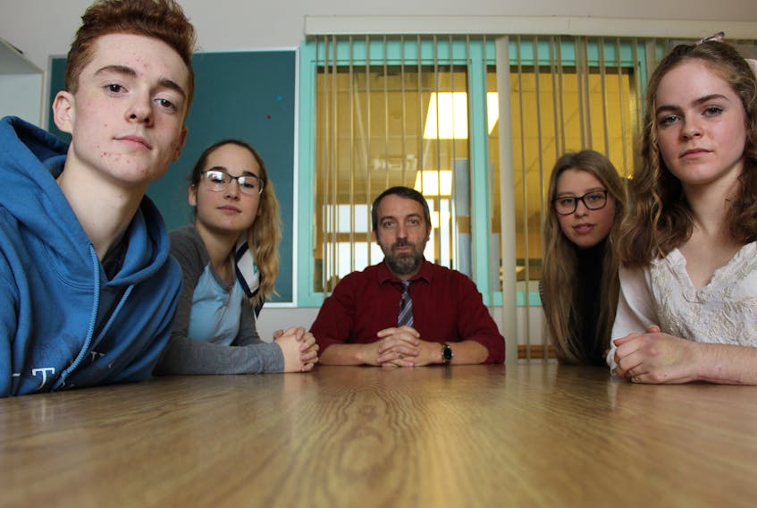 Staff and students at Kensington Intermediate Senior High School are mourning the loss of beloved school custodian Grant MacDonald who passed away Nov. 23. 
From left are students Caleb McKenna and Abby Christopher, teacher Richard Younker, and students Callie Champion and Marilyn Sheen.