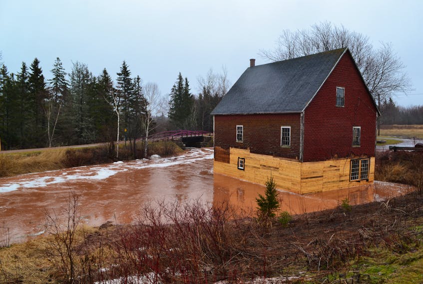 Despite water flowing right along its new lower level walls, Leard's Grist Mill in Coleman was standing tall Saturday on its new concrete footings, installed just last fall.