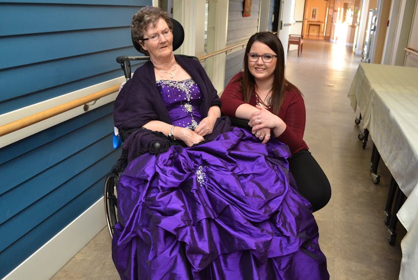 Jeneva Arsenault poses for a photo with her grandmother, Irene Handrahan, during Maplewood Manor’s Royal Winter Gala. For the occasion, Handrahan wore the gown Arsenault had worn to her high school prom nearly five years ago.