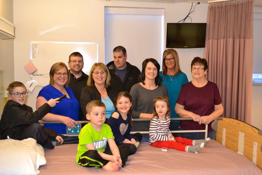 On hand for the official presentation of new television sets for the Western Hospital are family members of the late Doug Gallant, in front, grandchildren Dryden and Maddix Perry, Grace and Kate Gallant; standing, Valene and Clint Perry, Gail Gallant, Kramer and Amanda Gallant, Lori Peters and Norma Gallant. The Western Hospital Foundation was able to purchase 19 new TVs and the related mounting equipment with memorial donations made at Doug Gallant's wake last year.