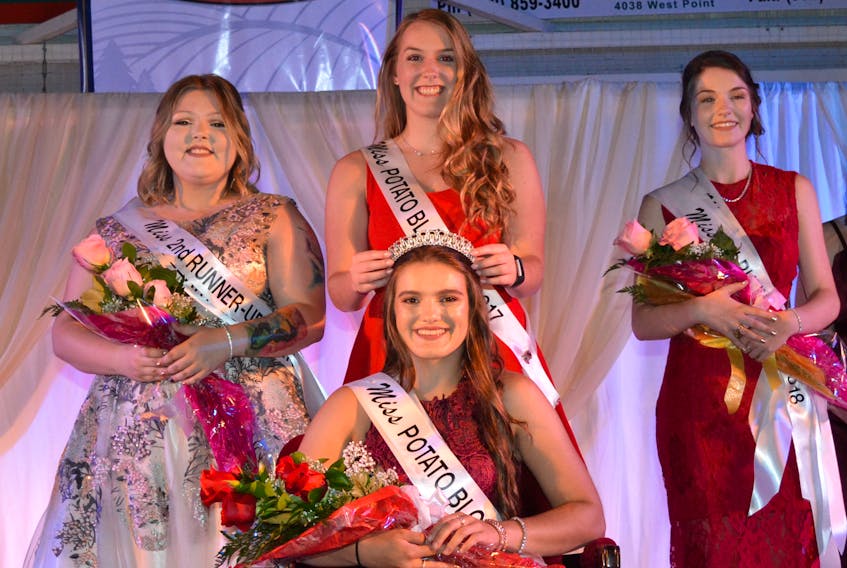 Taylor Rix, Miss Potato Blossom 2017, crowns her successor, Joselyn Jelley. Jelley also received banners for Miss Talent and Miss Fitness. Looking on, from left, are Second Runner-up Taylor Buote and First Runner-up and Miss Friendship, Jessica Howard.