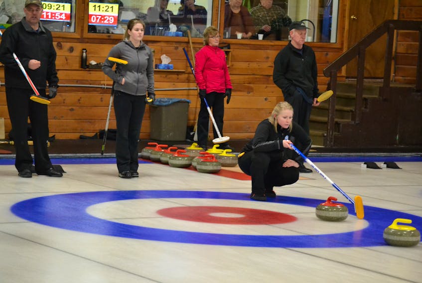 Aleya Quilty, mate on the Tyler MacKenzie Charlottetown rink, calls a shot during the opening draw of the P.E.I. Provincial Mixed Curling Championship at Western Community Curling Club. Looking on are  skip Calvin Smith and mate Lauren Ferguson from Crapaud and watching a shot on the adjacent ice, Iva Griffin and Glen Betts from the host Western club.