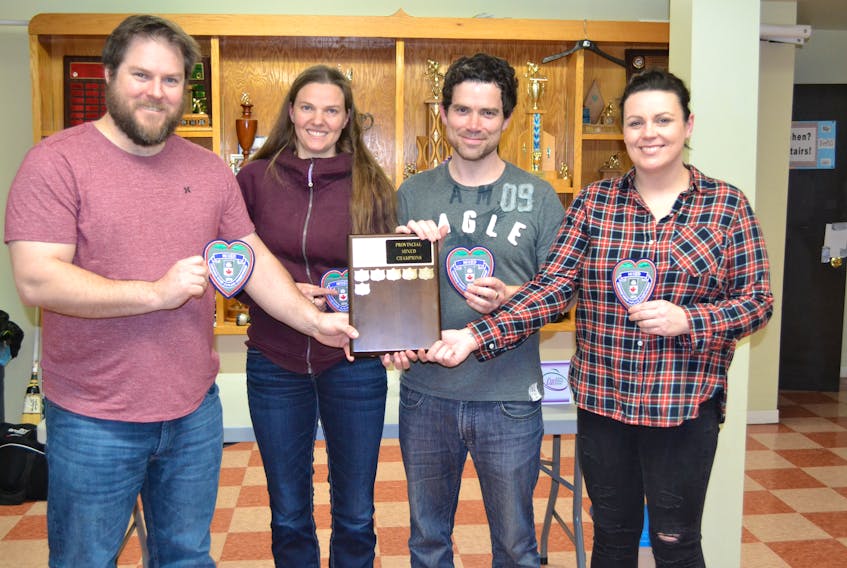 Team Newson from the Charlottetown Curling Complex and the Silver Fox Curling and Yacht Club, from left, Jamie Newson, Melissa Morrow, Andrew MacDougall and Miranda Ellis, display their team crests and Provincial Mixed Curling Championship plaque. They defeated the Tyler MacKenzie rink from Charlottetown 7-4 in Monday afternoon’s championship final at the Western Community Curling Club.