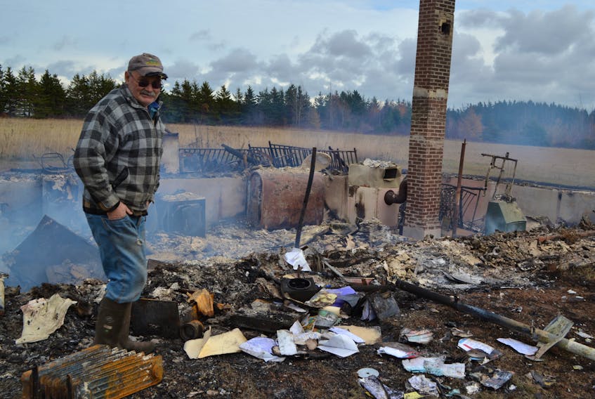 Wade Ellsworth of Nail Pond surveys what’s left of his nephew’s home. A series of two Halloween fires, on October 30 and early on November 1 levelled the home of Glen and Kim Ellsworth. The couple moved to Alberta four and a half years ago but was planning to return to their Nail Pond home.