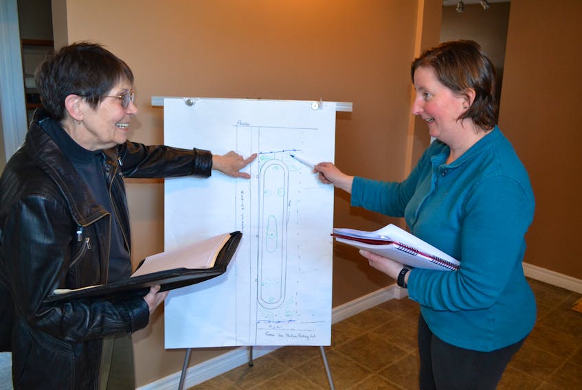 Committee members for a walking track and memorial garden planned for Alberton, Krystyna Pottier, left, and Kathryn Curtis finalize details for the walking track component now that a $23,000 grant from New Horizons has been awarded.