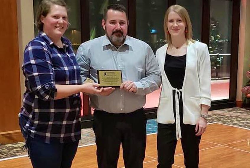 Kenny Ramsay is presented with the Paramedic Association of P.E.I. 2018 Paramedic of the Year Award by PAPEI central representative and awards organizer, Kyna MacInnis, right, and last year’s award recipient, Darby McCormick.