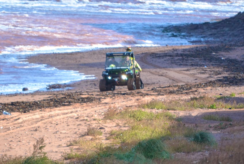 Members of the O’Leary Fire Department drive up the beach in Campbellton after recovering the body of missing Tignish fisherman Moe Getson Monday morning. Bodies of both fishermen missing since last Tuesday have now been recovered.