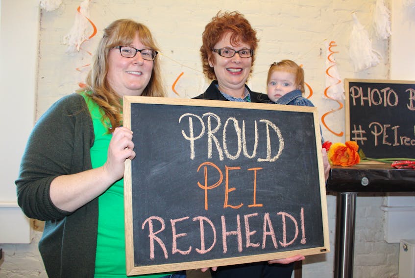 From left are Peggy Miles, Marilyn Waugh and her granddaughter Lily Cannon. Miles was one of the principal organizers of the first P.E.I. Redhead Gathering, which took place in Summerside, Friday evening.