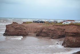 Tignish and area residents gathered all along the cliffs at North Cape Wednesday, hoping two missing fishermen will be found.