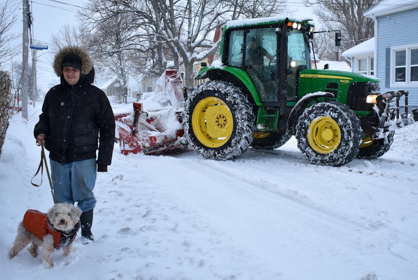 Trevor Caissie and his dog Lester were out on an early morning walk as a snow-plow crept behind to clear a path.