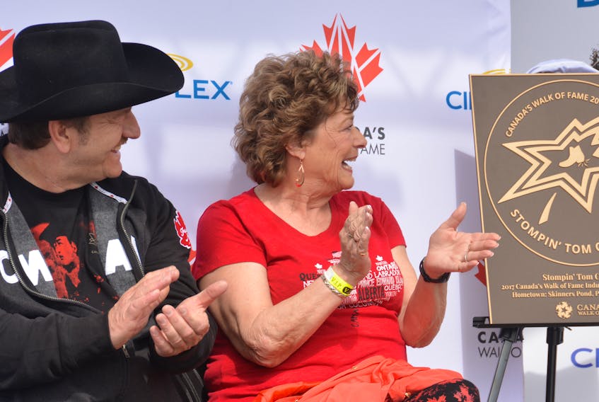 Stompin’ Tom Connors's son, Taw, and widow Lena Connors react to remarks made during the unveiling of Stompin’ Tom’s Hometown Star at the Stompin’ Tom Centre in Skinners Pond on Sunday. Taw Connors in the lineup of entertainers who performed at the weekend-long Stompin’ Tom Fest. The Hometown Star bronze plaque, at the right, will be displayed inside the interpretive centre.