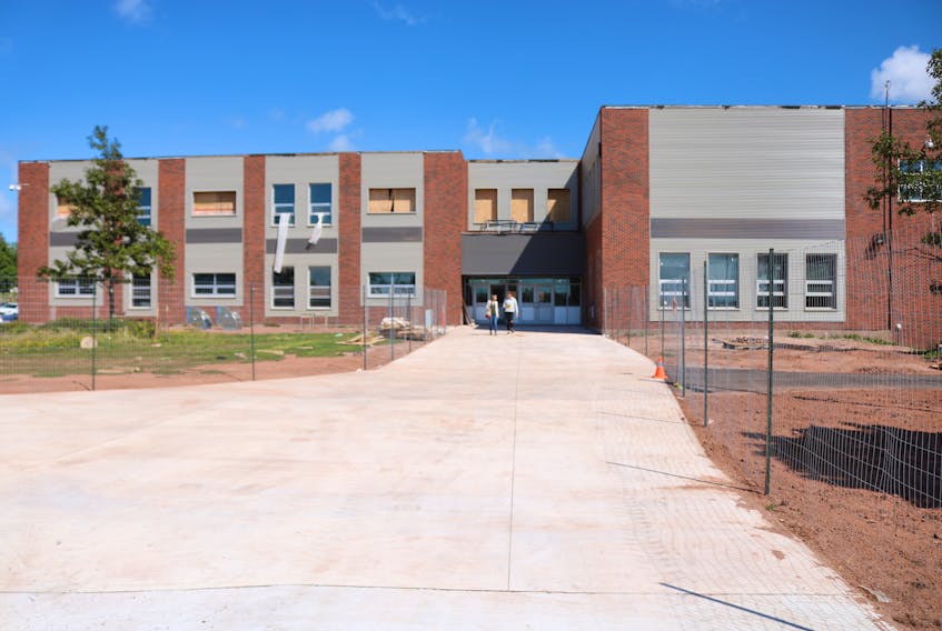 Government officials toured Three Oaks Senior High School on Friday. Construction of the school will be completed next year, reaching 85 per cent of completion by the end of October.