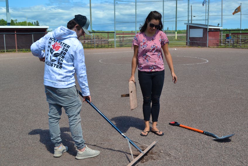 O’Leary Recreation director Jessica Gillis and summer staff member Jayden Gaudet adjust the bases on Ellis field in preparation for the Eastern Canadian Under 12 softball championships which take place in O’Leary from August 24 to 26. Twelve teams are confirmed.