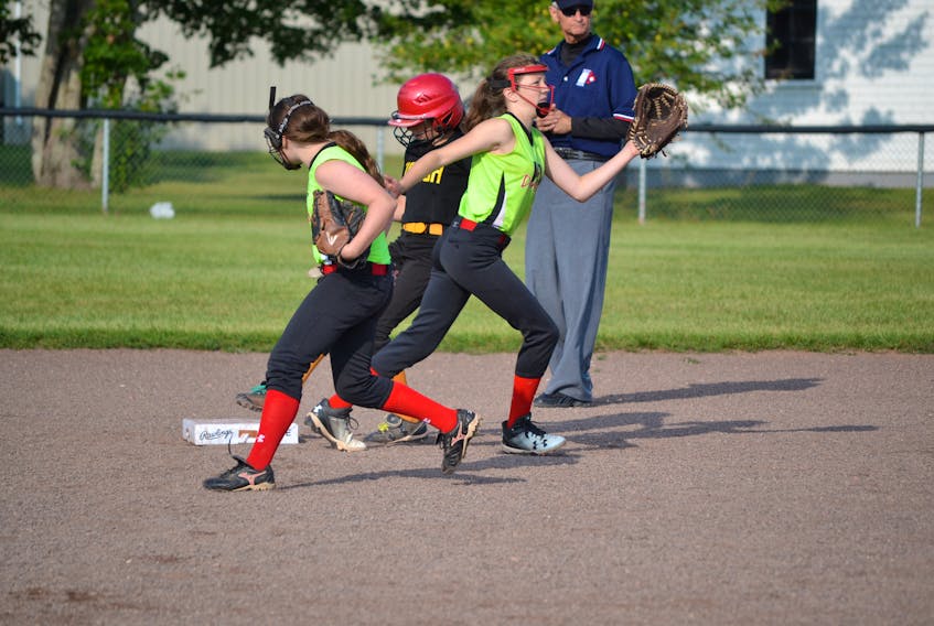 Tignish’s Jade Hackett makes her way through traffic to steal second during Tignish’s game against New Brunswick’s KV Dynamite in Eastern Canadian U12 softball action on Jeff Ellsworth Field in O’Leary Friday morning. Tignish edged O’Leary 7-5 in the tournament opener Thursday evening but fell to the Dynamite 9-1 in their morning game.