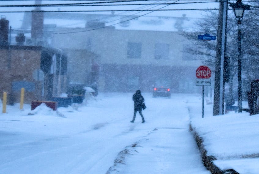 A silhouette of a person walking in downtown Summerside during the snow blizzard.