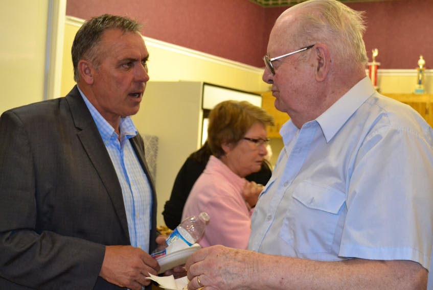 Health Minister Robert Mitchell, left, and area resident Gordon Wooder discuss health matters following the annual meeting of the Stewart Memorial Health Foundation’s annual meeting Tuesday in Northam. Wooder moved a motion of support for the foundation to continue to work towards obtaining the Stewart Memorial Home and turning it into a community care facility.