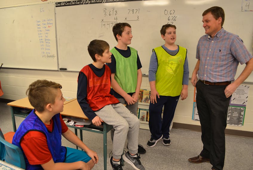 Bloomfield Elementary School principal and Grade 6 Math teacher Andrew Stewart has an after-school chat with graduating students, from left, Jordan Shaw, Reece Gallant, Gabe Stewart and Bennett Griffin. Stewart is the 2018 recipient of the P.E.I. Teachers Federation’s Excellence in Teaching Award.