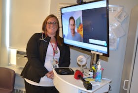 Nurse Stephanie Gaudet, at Western Hospital and Dr. Brett Belchetz, on the video monitor, CEO of Maple, an Ontario-based telemedicine company, explain how tele-rounding works. Western Hospital in Alberton is the first hospital in Canada to pilot tele-rounding.