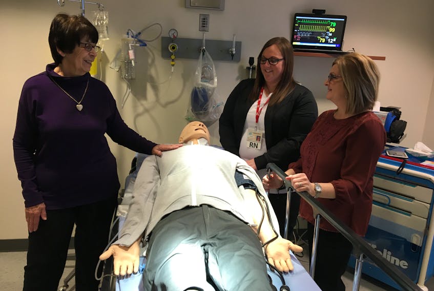 O’Leary Community Health Foundation chair Eva Rodgerson, from left, gets a demonstration from Stephanie Gaudet, Clinical Nurse Educator for Community Hospitals West; and Susanne LaPierre, Director of Nursing, on how Community Hospital’s new simulator training lab can help staff members practice and perfect skills.