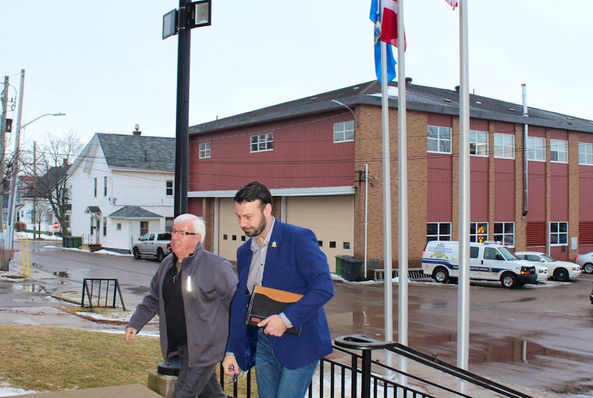 Summerside Councillors Bruce MacDougall, left, and Justin Doiron arrive at City Hall Feb. 5 for council committee meetings.
