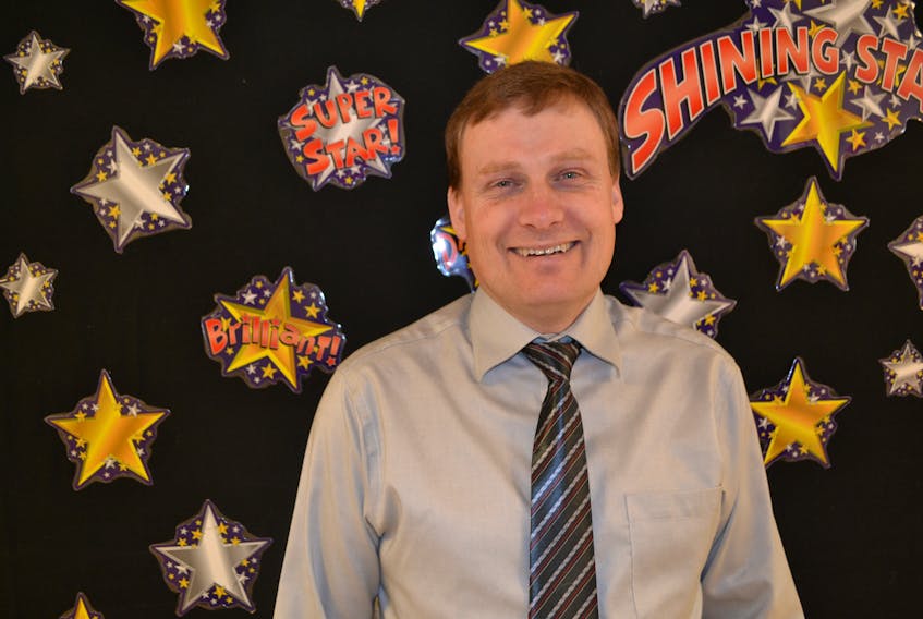 Andrew Stewart, principal at Bloomfield Elementary School, shown in front of a students achievement wall, has been selected by The Learning Partnership as one of Canada's Outstanding principals for 2019. He will receive his award next month in Toronto.