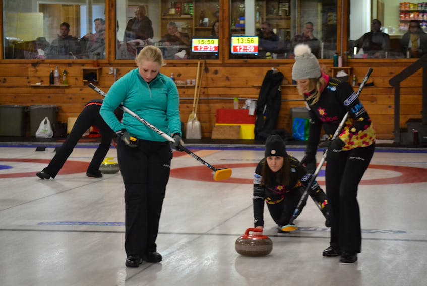 Skip Sarah Fullerton releases a rock during the P.E.I. Scotties provincial women’s curling championship in Alberton as her front end, Aleya Quilty, left, and Anita Casey await sweeping instructions.  Fullerton downed previously unbeaten Veronica Smith Friday night to move to 4-1 (won-lost) in the standings with Smith.