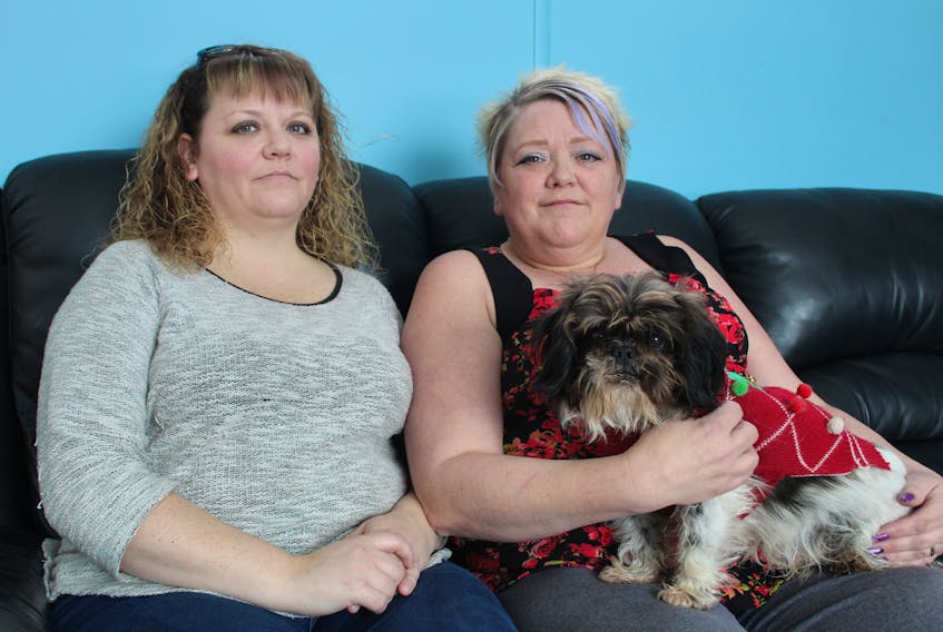 Jaime Skiffington (sister), Kim Skiffington-Baglole (aunt) and Buddy the dog at Kim’s home. Both women are family to Jeremy Stephens, 32, of Summerside, who was killed by police in May, 2018. Almost nine months later they are still waiting for answers about why Stephens was shot.