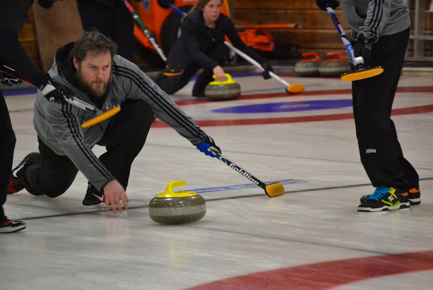 Skip Jamie Newson from the Silver Fox, keeps his eyes trained on the target broom as he releases a shot during his men’s Tankard game against defending champion Eddie MacKenzie.