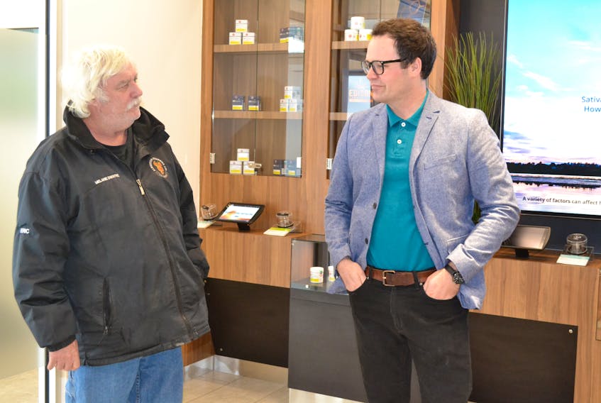 O’Leary mayor Eric Gavin, left chats with Zach Currie, director of cannabis operations for the P.E.I. Cannabis Management Corporation, during a tour of the O’Leary cannabis store on Wednesday. The store opens for business Friday.