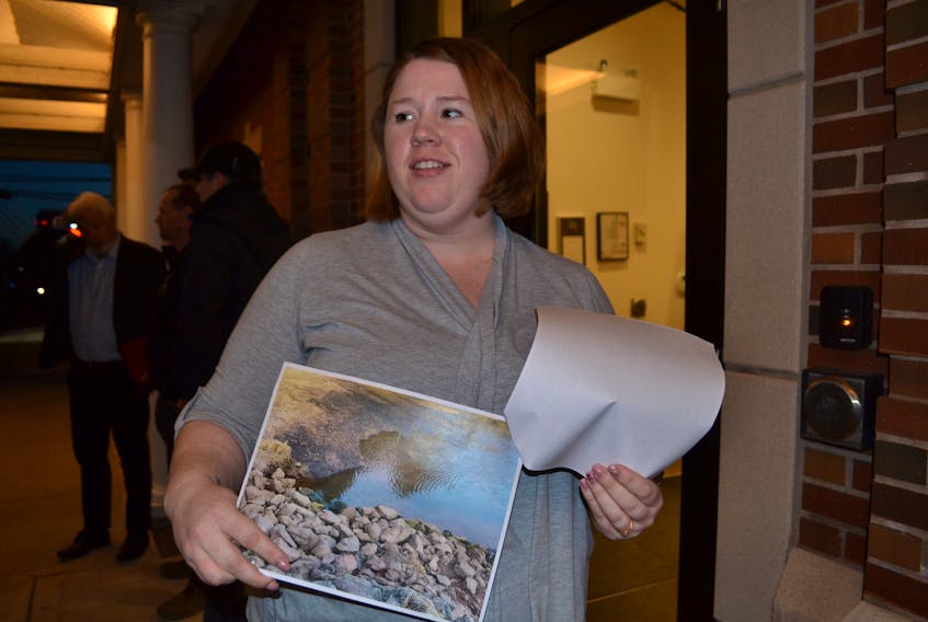 Northport councillor Carrie Quinn arrived at the Town of Alberton’s information meeting about sewer lagoon upgrades armed with photos showing items floating in the lagoon cell that Alberton wants to empty into the Alberton Creek.