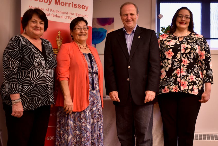Andy Lou Somers with the East Prince Women’s Information Centre, left, Marlene Thomas with the Aboriginal Women’s Association of P.E.I. Inc., Egmont MP Bobby Morrissey and Nancy Beth Guptill with the East Prince Women’s Information Centre gather in Summerside on May 24.