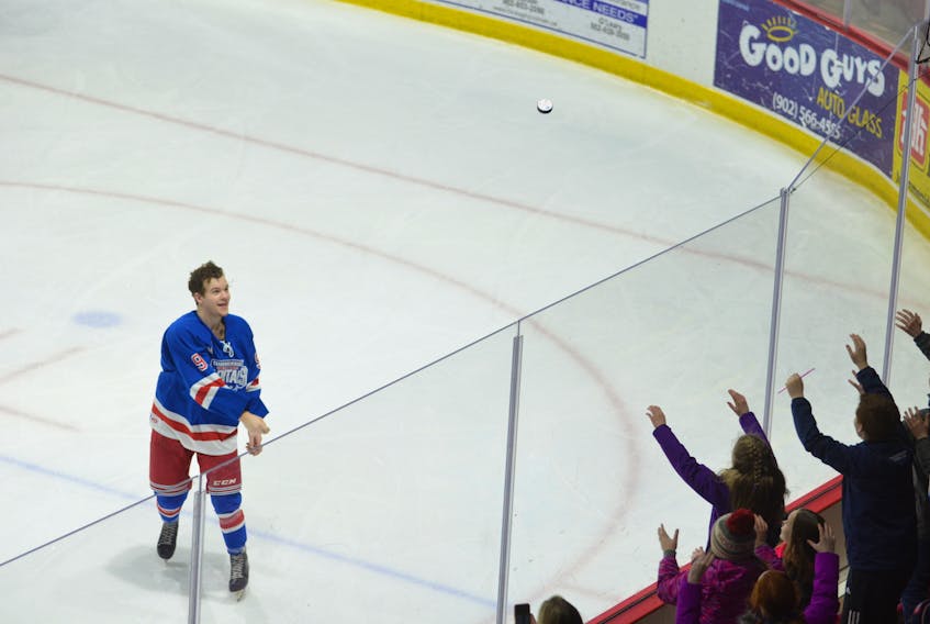 Summerside Western Capitals forward Kayden Peck tosses a souvenir into the stands after being introduced as the first star of Saturday night’s MHL (Maritime Junior Hockey League) game at Eastlink Arena. Peck scored four goals and added two assists in leading the Caps to an 8-3 win over the visiting Miramichi Timberwolves.