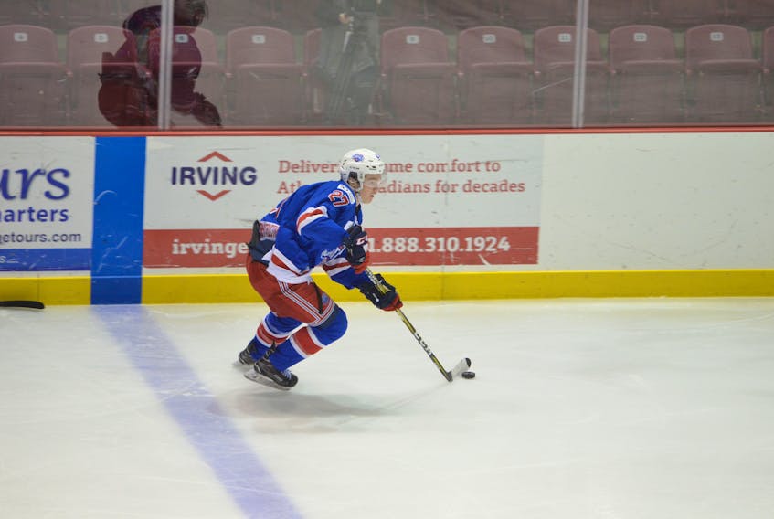 Summerside D. Alex MacDonald Ford Western Capitals forward Brodie MacArthur carries the puck into the offensive zone during MHL (Maritime Junior Hockey League) action at Eastlink Arena.