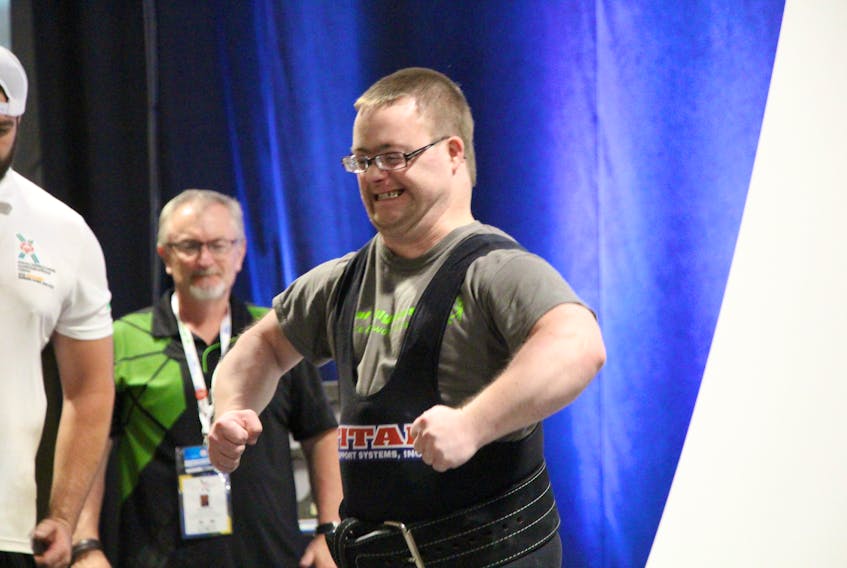 Kolton Doucette of Wellington Station gives the crowd a gun show during the powerlifting competition at the Special Olympics Canada 2018 Summer Games in Antigonish, N.S., last week. Special Olympics P.E.I. Photo