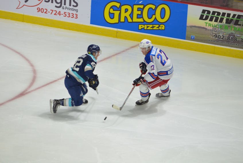 Summerside Western Capitals forward Brodie MacArthur looks to make a move around the Edmundston Blizzard’s Tristan Mercure during MHL (Maritime Junior Hockey League) action at Eastlink Arena on Oct. 13. The Caps were ranked No. 7 in this week’s Canadian Junior Hockey League’s top-20 rankings.