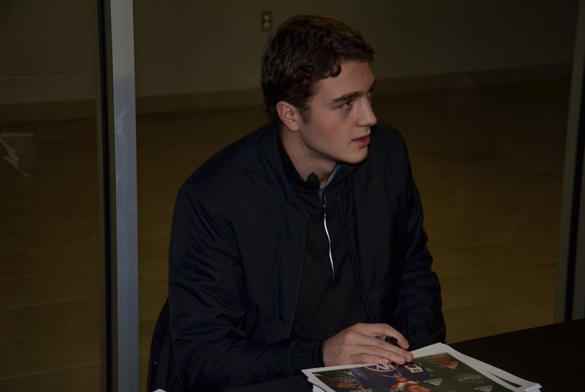 Noah Dobson of Summerside signs autographs during the Summerside Western Capitals’ MHL (Maritime Junior Hockey League) game against Amherst at Eastlink Arena on Saturday night. Dobson played for Team Canada in the 2019 International Ice Hockey Federation world junior championship in Vancouver and Victoria, B.C.