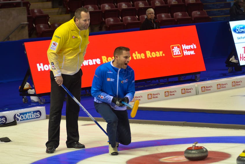 John Morris yells instructions to his sweeps while opposing skip Jamie Murphy looks on intently. The two teams met in Draw 2 of the 2017 Home Hardware Road to the Roar Pre-Trials curling event at Eastlink Arena on Monday night. Morris prevailed 9-3. Jason Simmonds/Journal Pioneer
